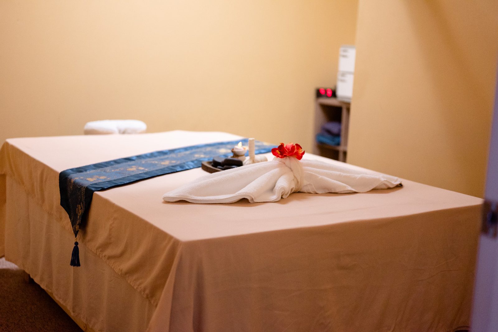 Serene single massage room with towel art at Magnolia Wellness Massage